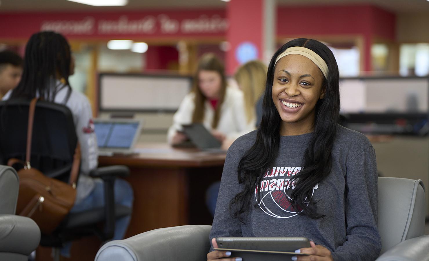 student sitting in the library